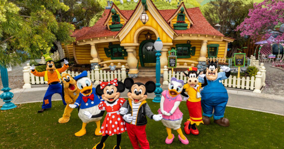 Mickey Mouse, Minnie Mouse and their pals pose in the newly reimagined Mickey's Toontown at Disneyland Park in Anaheim, Calif. For the first time at any Disney park, Pete also makes appearances as he causes mischief around the neighborhood. Mickey Mouse sports a new outfit specifically for when he is greeting guests outside of his home. At this animated neighborhood, families can explore, play, discover and unwind together while enjoying new interactive experiences, returning familiar favorites and the new attraction Mickey & Minnie’s Runaway Railway. (Christian Thompson/Disneyland Resort)